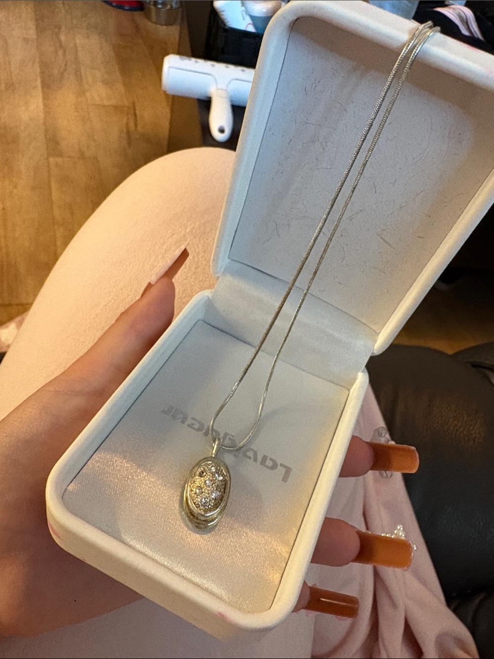 Silver Oval Pendant Necklace with Sparkling Stones